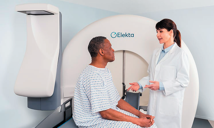 Photo of female doctor with patient next to Elekta products