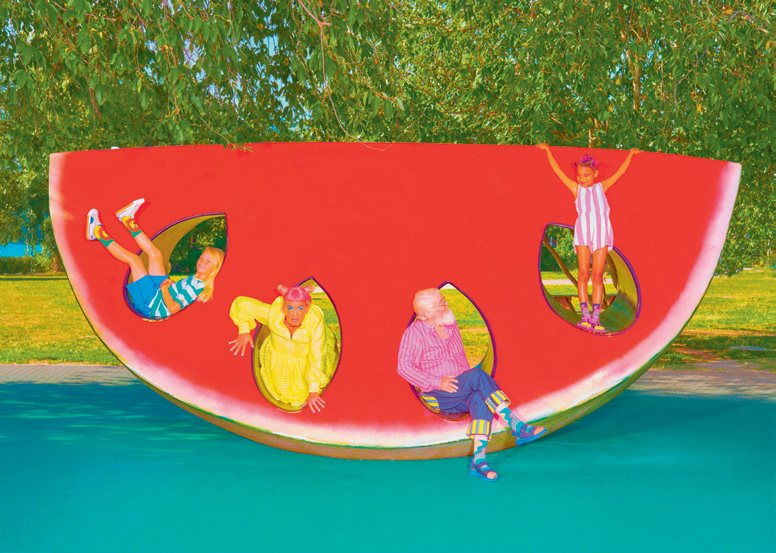 Kids playing in large watermelon inspired playset